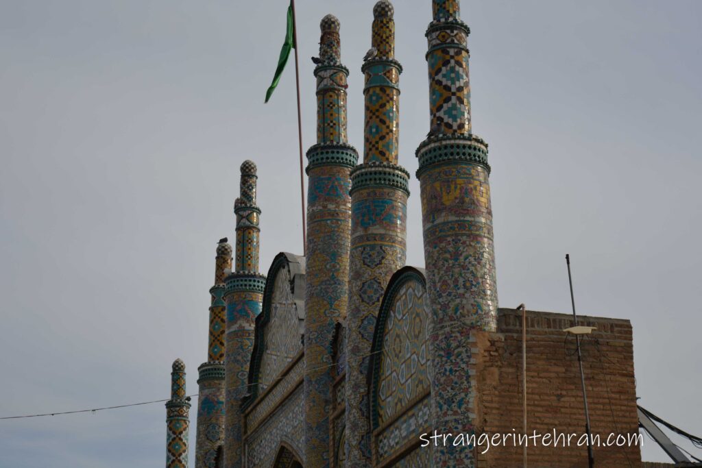 the towers of Imamzadeh Hossein covered with tiles
