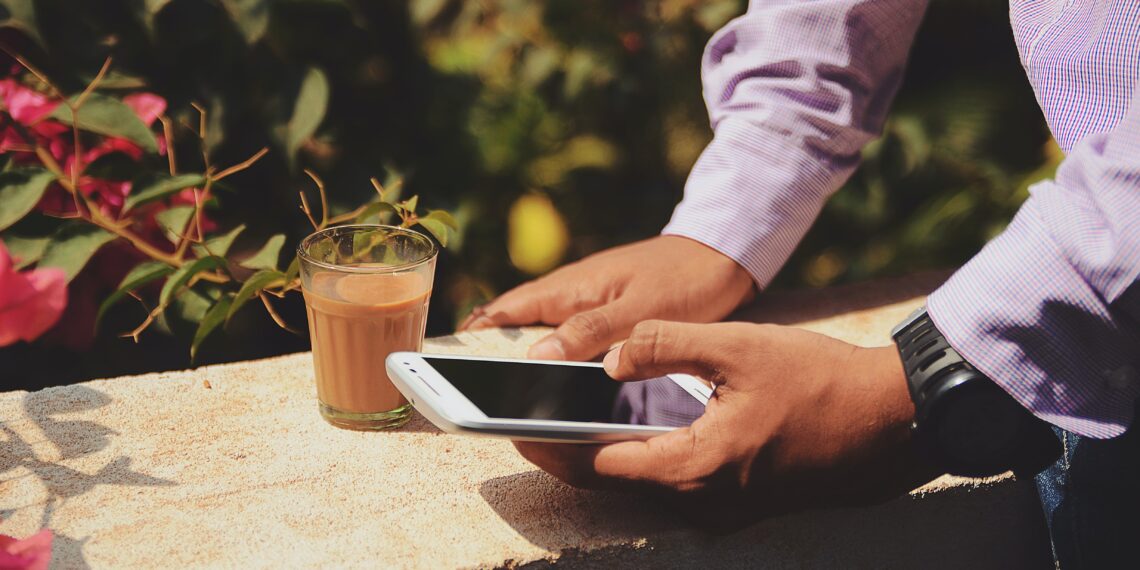 Man holding a smartphone Photo by Rohit Tandon on Unsplash